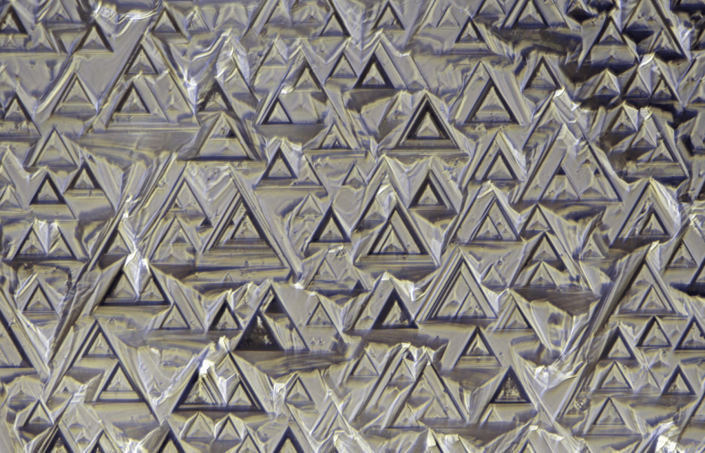 Trigons on a diamond crystal from Udachnoe kimberlite pipe, Sakha, Russia